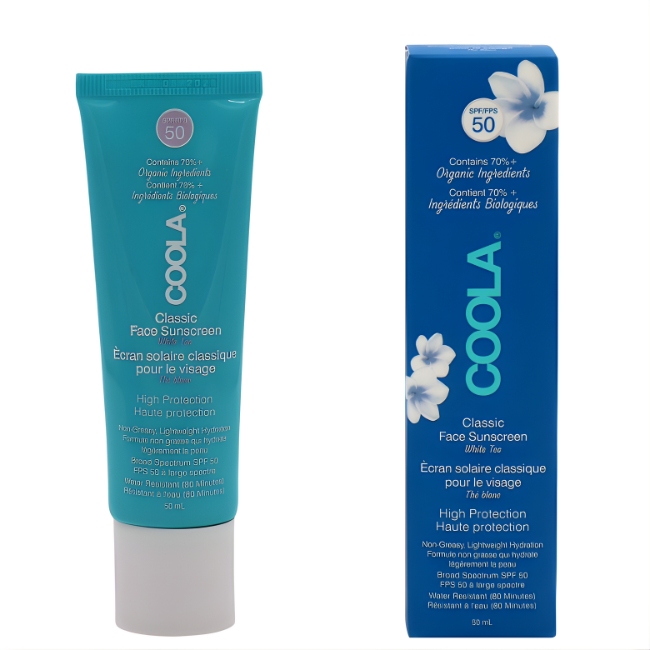 COOLA Classic Face Sunscreen SPF 50 in a turquoise 50ml tube, displayed next to its tall, deep blue vertical box featuring white floral accents and SPF 50 branding.